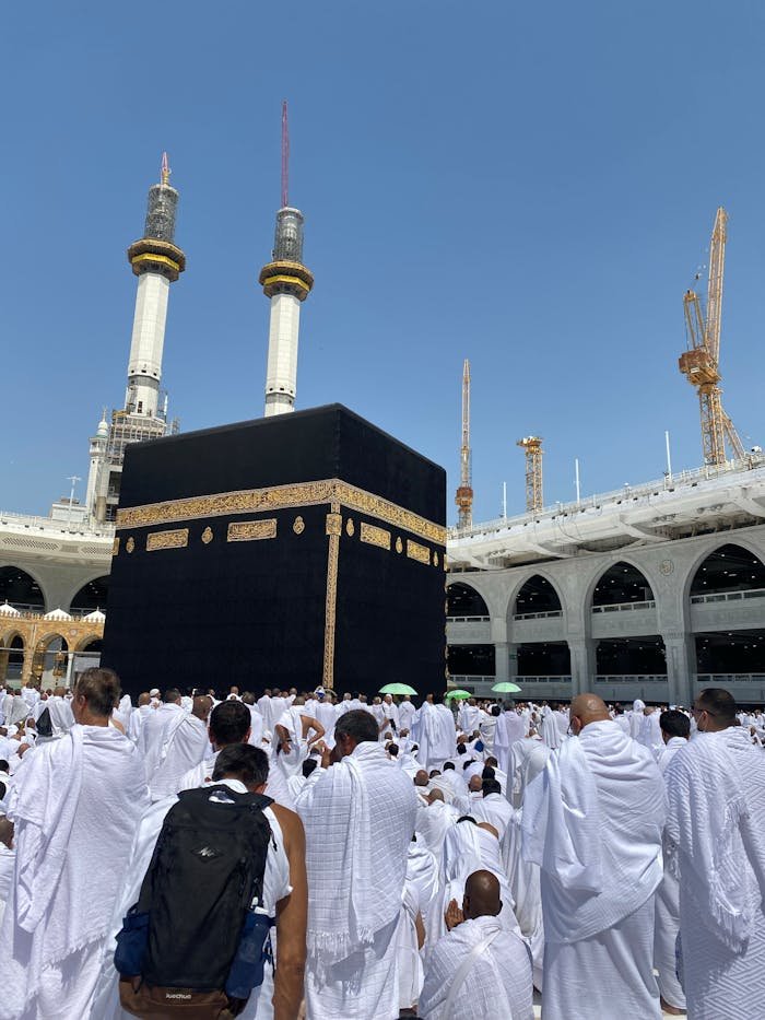 People in Ahram Clothing on Pilgrimage Praying by Kaaba in the Courtyard of the Great Mosque of Mecca